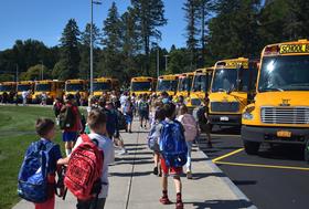 TES students head to the bus after a good first day