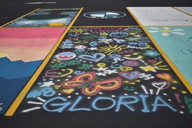 Painted parking spot with graffiti butterflies